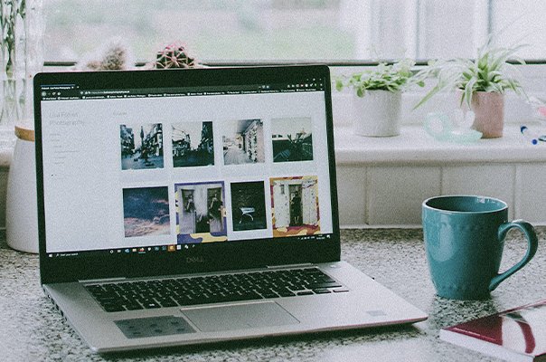 Home office desk setup with laptop and productivity tools
