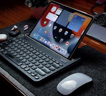 People working remotely on laptops with icons of digital business and social media