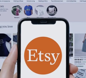 Laptop screen showing Etsy shop with digital planners and art prints