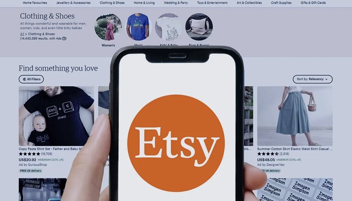 Laptop screen showing Etsy shop with digital planners and art prints