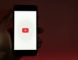 Laptop showing faceless YouTube channel making passive income