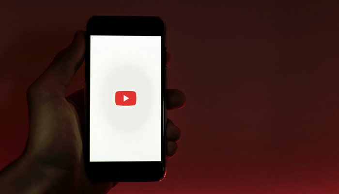 Laptop showing faceless YouTube channel making passive income