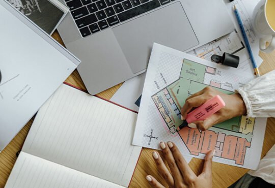 Man working from laptop at home, exploring side hustles for online income 2025.