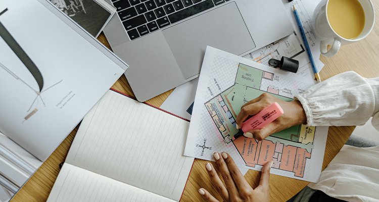 Man working from laptop at home, exploring side hustles for online income 2025.