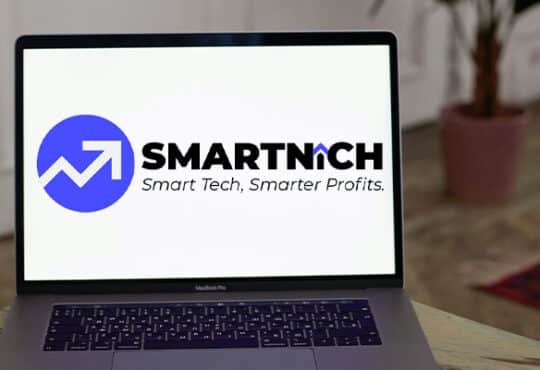 A professional freelancer working on a laptop using AI productivity tools in a modern office.